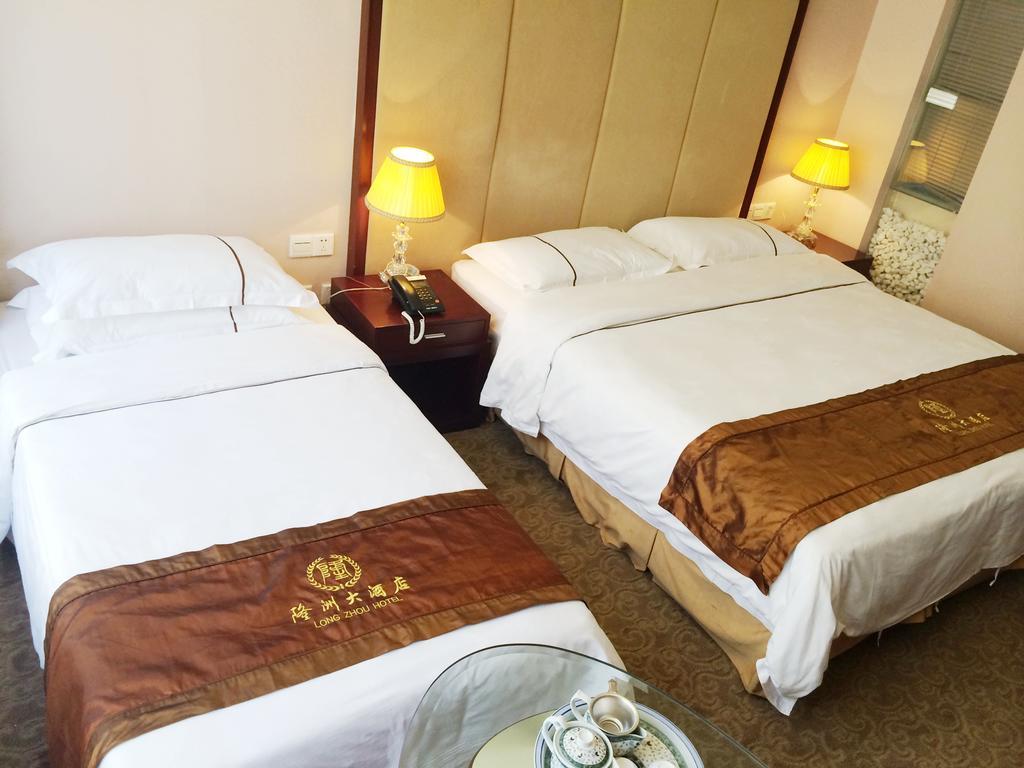 Long Zhou Grand Hotel Cantón Habitación foto