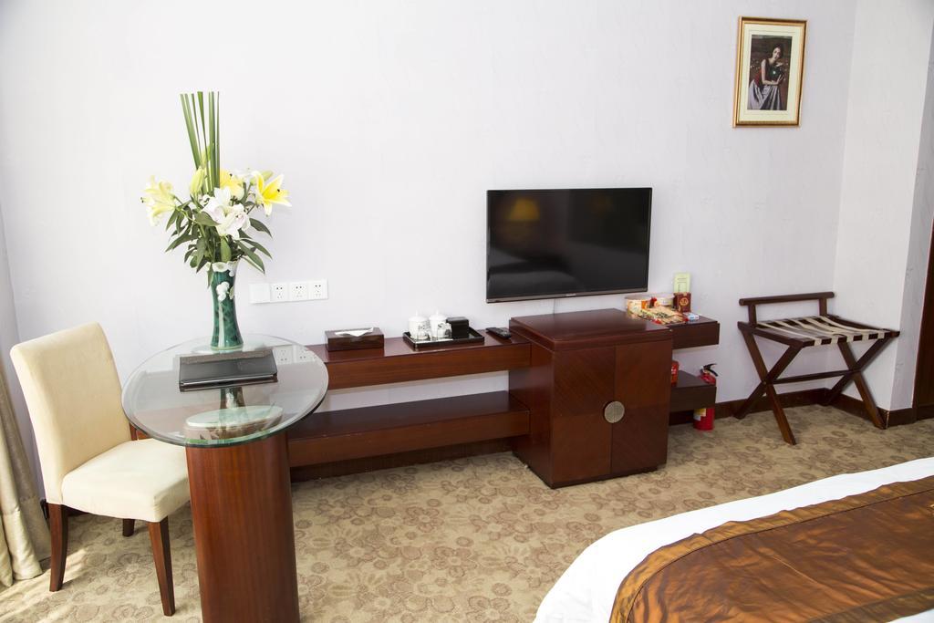 Long Zhou Grand Hotel Cantón Habitación foto