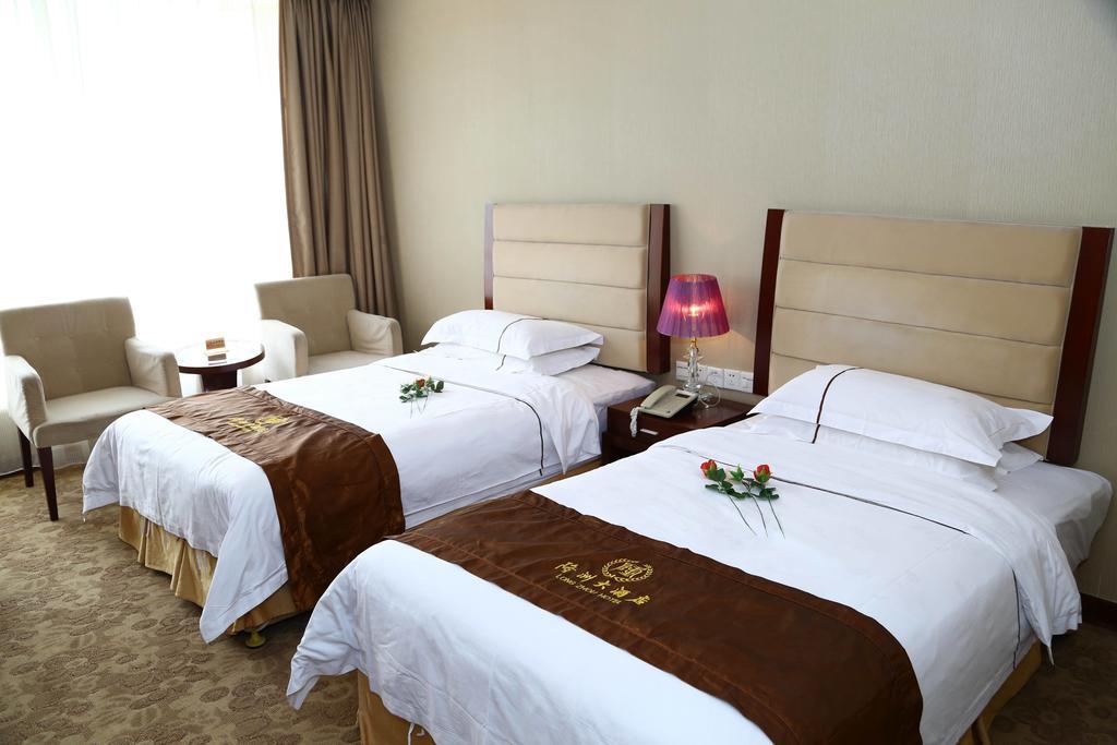 Long Zhou Grand Hotel Cantón Habitación foto