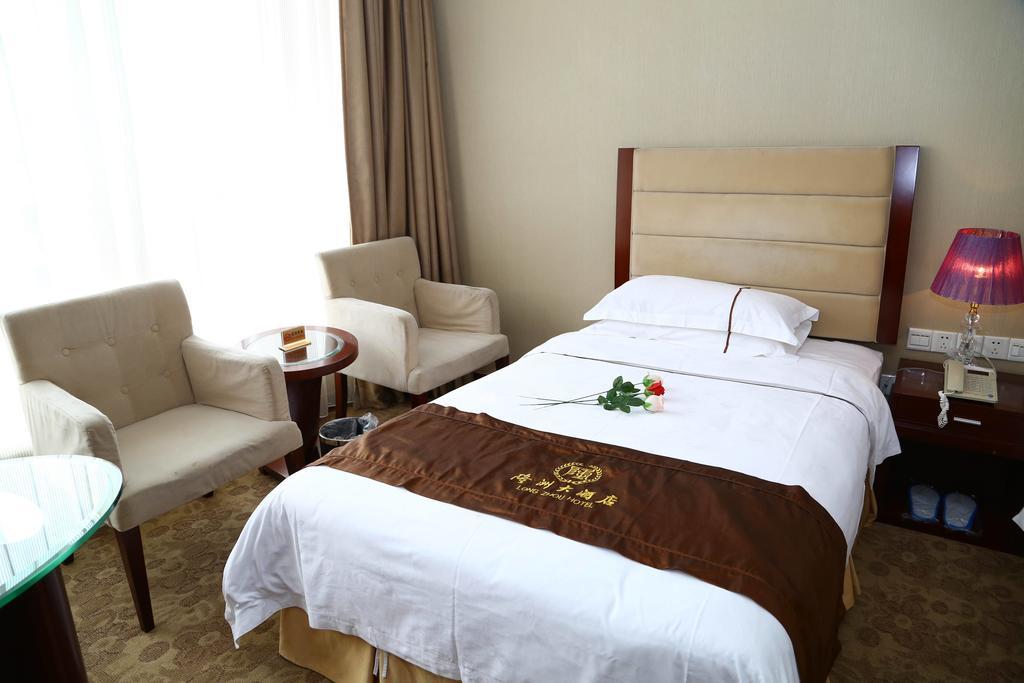 Long Zhou Grand Hotel Cantón Habitación foto
