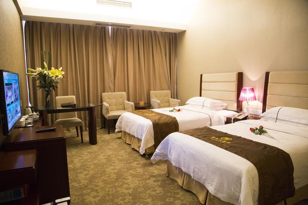 Long Zhou Grand Hotel Cantón Habitación foto