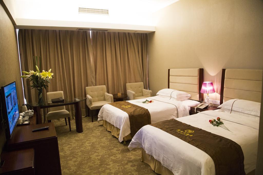 Long Zhou Grand Hotel Cantón Habitación foto