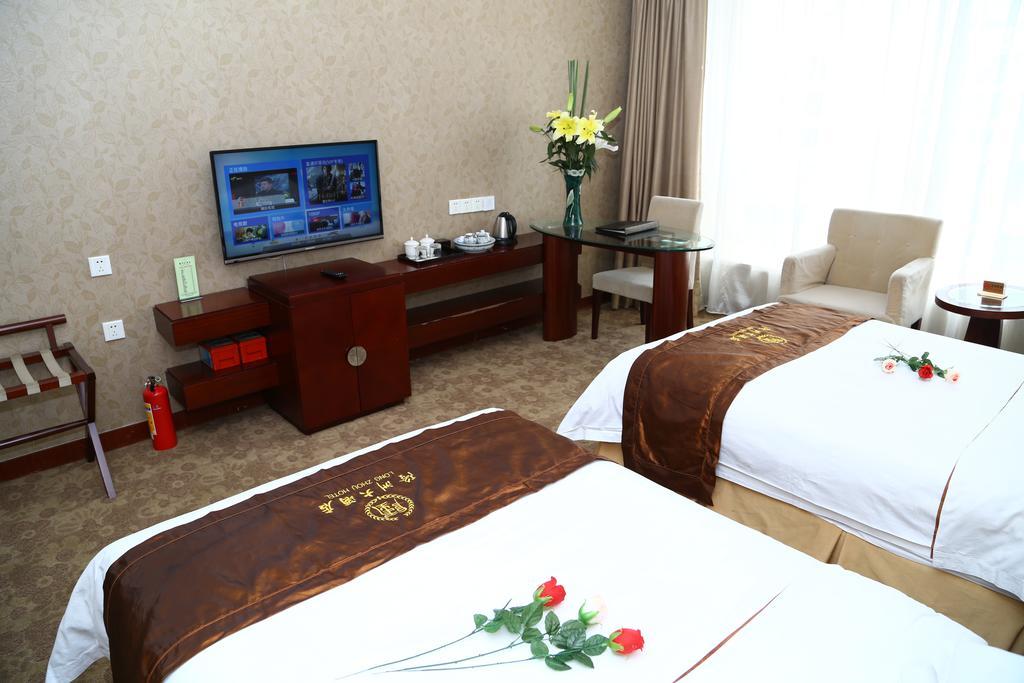 Long Zhou Grand Hotel Cantón Habitación foto