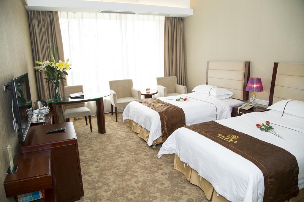 Long Zhou Grand Hotel Cantón Habitación foto